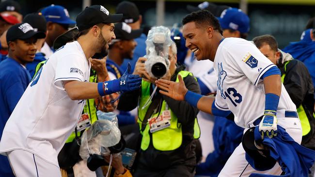 Eric Hosmer and Salvador Perez bask in their win.