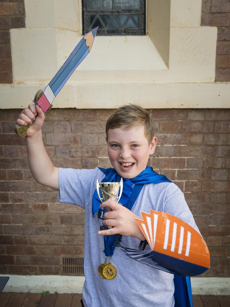 Lawson Plumbe shows his wining medals after competing in speech and drama sections of the 77th City of Toowoomba Eisteddfod at Empire Theatres, Monday, July 31, 2023. Picture: Kevin Farmer