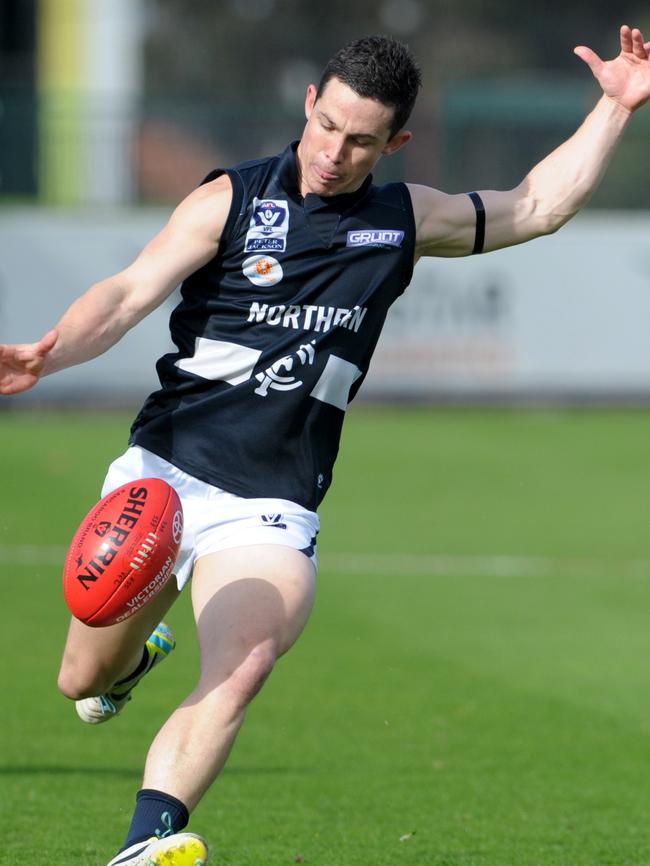 Tom Wilson launches a kick forward for Northern Blues in 2014. Picture: Kylie Else.