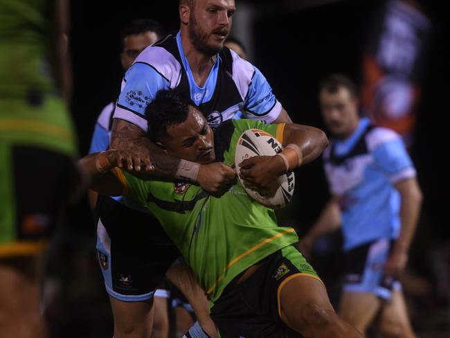 Northern Sharks Clint Chettle tackles Palmerston Raiders in the NRLNT Grand Final 2022. Picture: (A)manda Parkinson