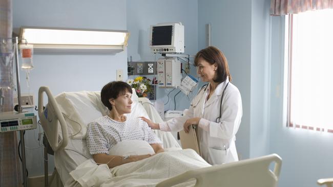 Female doctor comforting female patient lying in hospital bed. generic. Thinkstock. Picture: Supplied