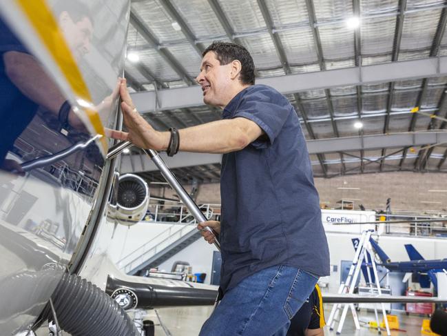 Chris Garner steps inside the plane after visiting it again for the first time since the incident. Picture: Floss Adams.