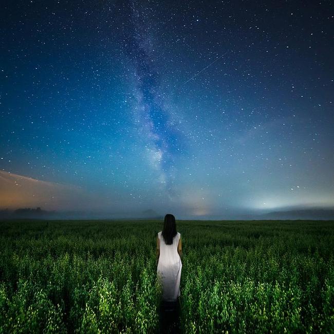 © Kimmo Kuisma, Finland, Entry, Open, Low Light, 2016 Sony World Photography Awards “I wanted to capture this long exposure image right in the middle of a dark night with the Milky Way showing. The image shows a woman walking along a path, a path which seems to lead up to the Milky Way. She may be heading to her physical home for now, but eventually we all return to our stellar origins as starstuff. My goal was to capture a portrait that displays not just the physical aspects of a person, but a portrait of her whole being as a part of a larger universe.”