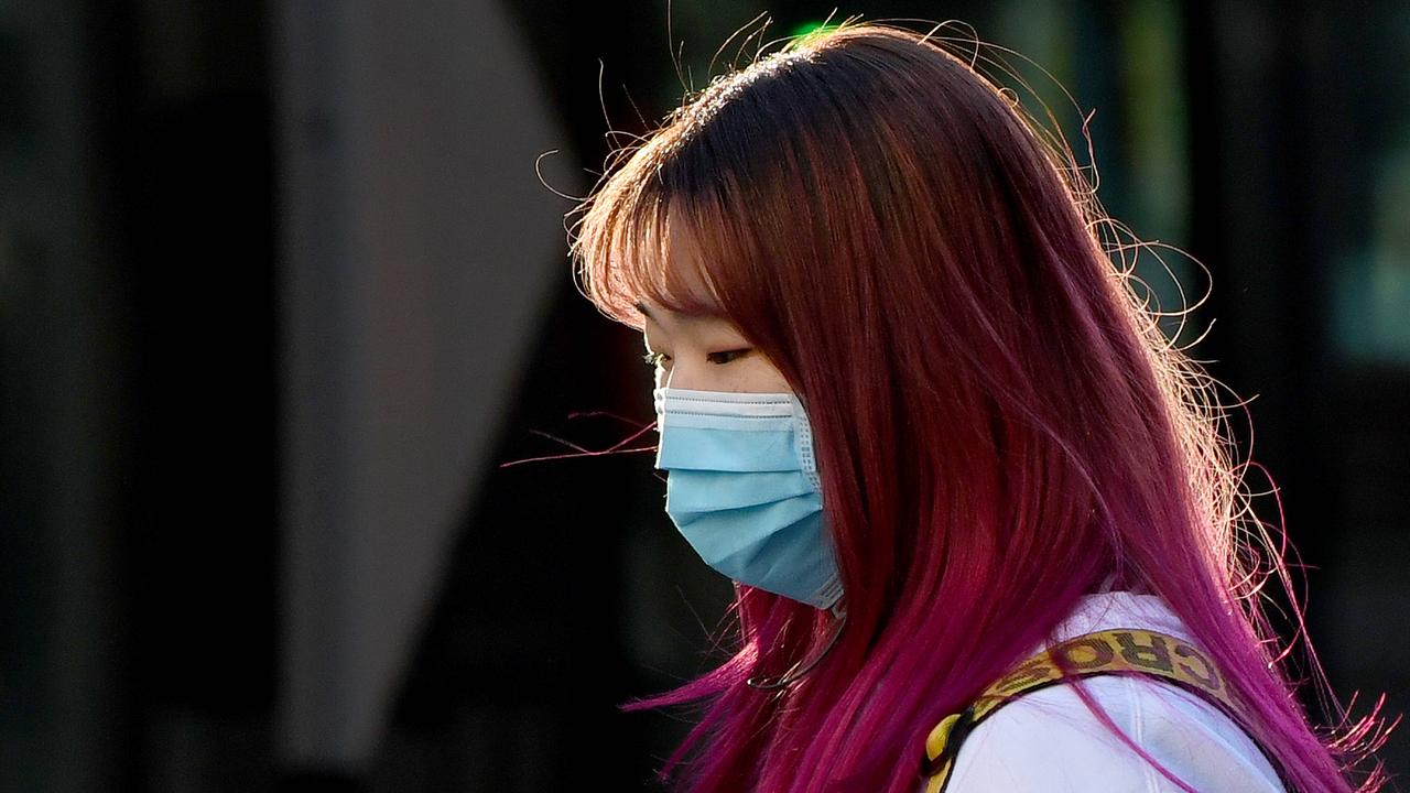 A women is seen wearing a face mask as a preventative measure against the coronavirus disease in Sydney. Picture: NCA NewsWire / Bianca De Marchi