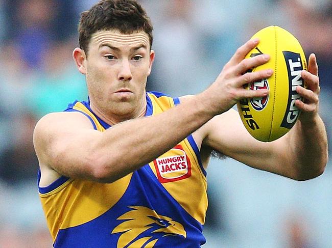 MELBOURNE, AUSTRALIA - APRIL 21:  Jeremy McGovern of the Eagles runs with the ball from Charlie Curnow of the Blues  during the round five AFL match between the Carlton Blues and the West Coast Eagles at Melbourne Cricket Ground on April 21, 2018 in Melbourne, Australia.  (Photo by Michael Dodge/Getty Images)