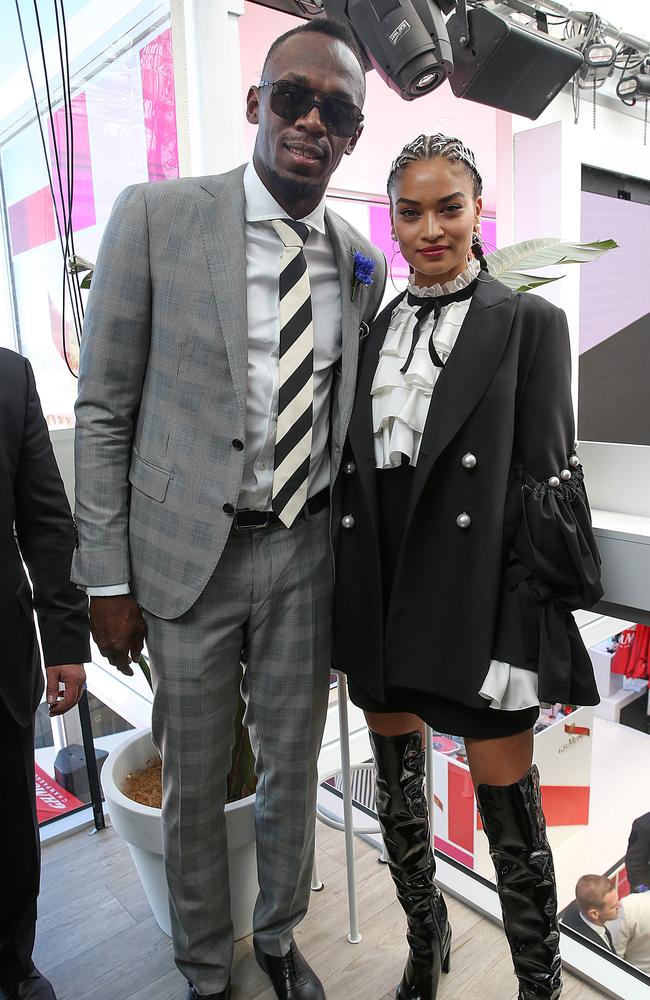 Usain Bolt and Shanina Shaik in the Birdcage at Derby Day. Picture: Ian Currie