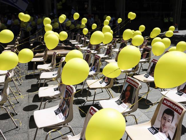 Yellow balloons were placed on chairs in Martin Place, symbolising the hostages, including children, kidnapped by Hamas during the conflict. Picture: NCA NewsWire/ Dylan Robinson