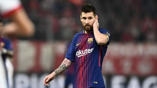 Lionel Messi reacts. / AFP PHOTO / ARIS MESSINIS