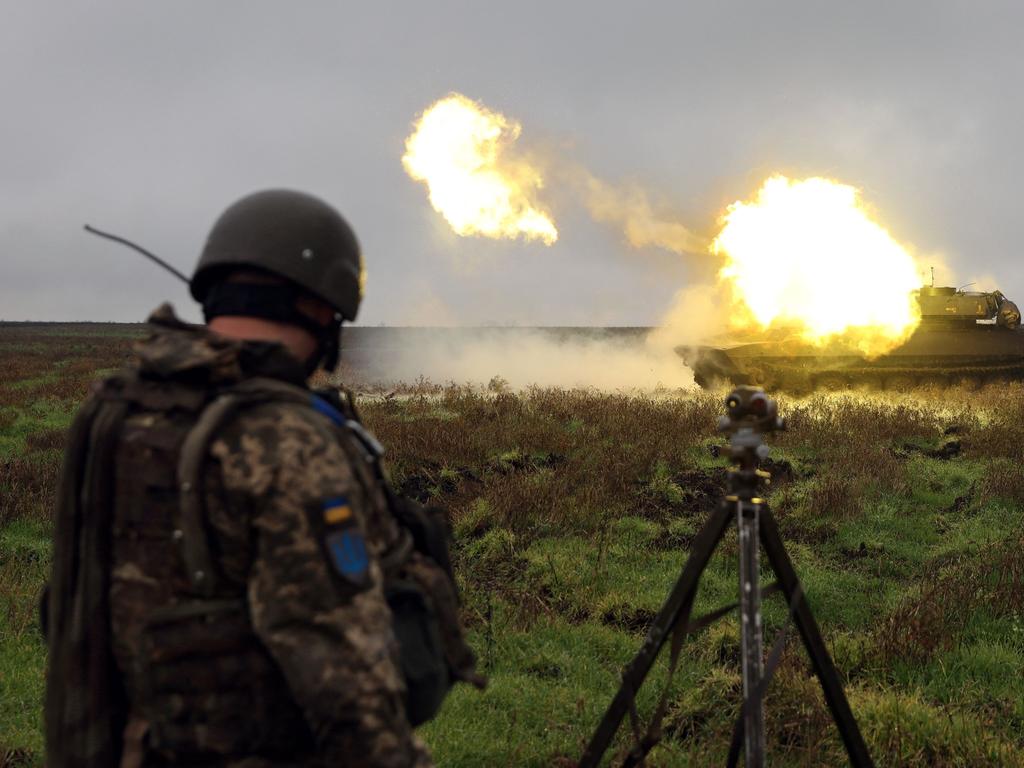 A Ukrainian soldier stands as a 2S1 Gvozdika self-propelled howitzer fires a shell on the front line in Donetsk region on October 10, 2022. Picture: Anatolii Stepanov/ AFP.