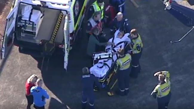 The girl being treated after she was struck by a car. Picture: Seven news