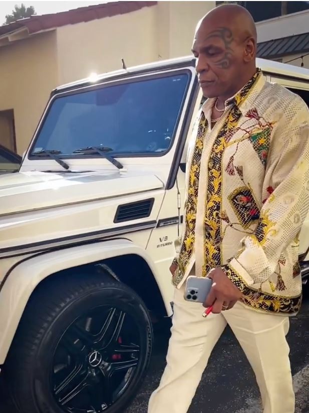 'Iron' Mike Tyson with his G-wagon. Picture: The Sun