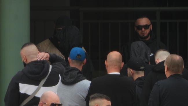 Mourners including alleged Hells Angels bikie Mustafa Hafizi (back right) pay tribute to Gulasi at Gallipoli Mosque in Auburn.