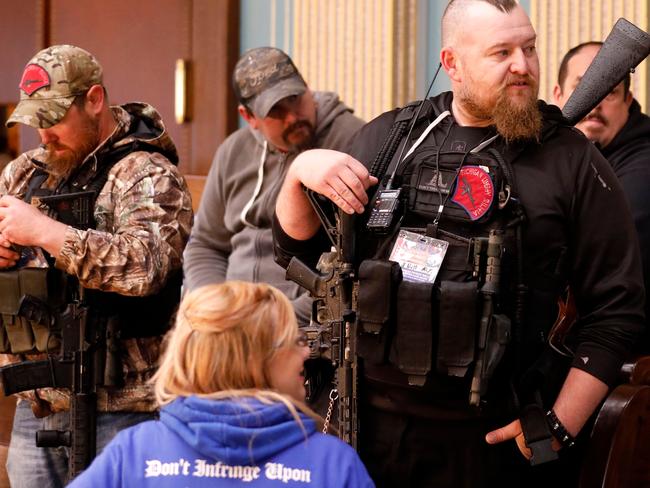 William Null (right) stands in the gallery of the Michigan Senate Chamber during the American Patriot Rally. Picture: AFP