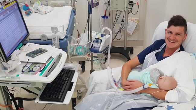 The photo of ICU nurse Dakota Parker cradling Ethan Moodie that was posted on the hospital’s Facebook page last December. Picture: Daniel Moodie