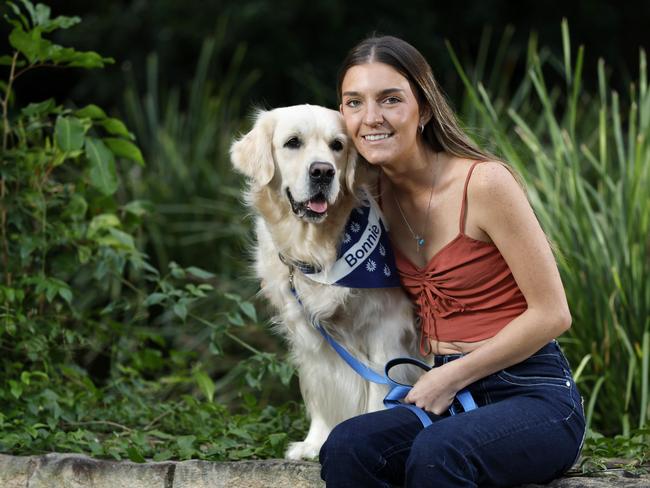 Summer Stevenson with Bonnie the therapy dog. Picture: Josh Woning