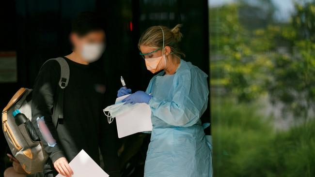 Frontline workers wearing protective clothing at Northern Beaches Hospital. Picture: Tim Pascoe