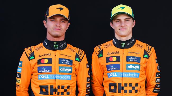 MELBOURNE, AUSTRALIA - MARCH 13: Lando Norris of Great Britain and McLaren and Oscar Piastri of Australia and McLaren looks on during previews ahead of the F1 Grand Prix of Australia at Albert Park Grand Prix Circuit on March 13, 2025 in Melbourne, Australia. (Photo by Clive Rose/Getty Images)