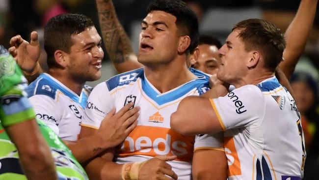 Titans star David Fifita is swamped by teammates afetr scoring in the Gold Coast's rout of the Raiders in Canberra. Picture: NRL Images