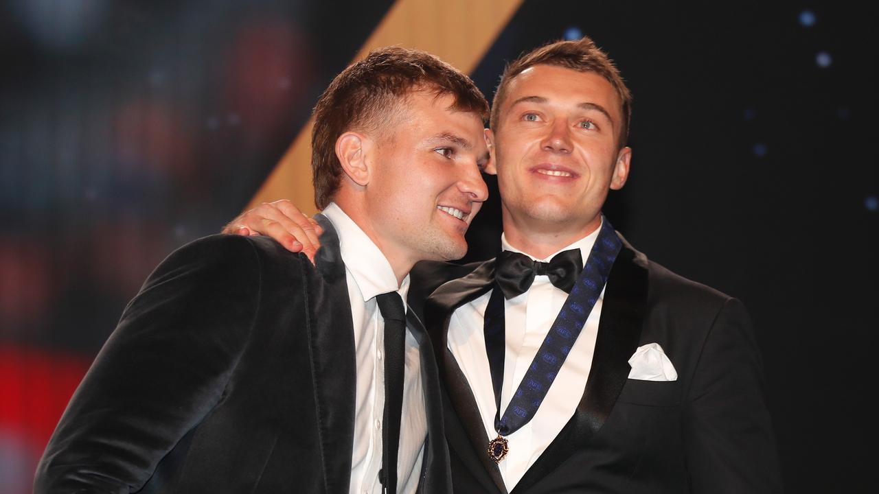 Ollie Wines presents Patrick Cripps with his Brownlow Medal. Photo by Michael Willson/AFL Photos via Getty Images.