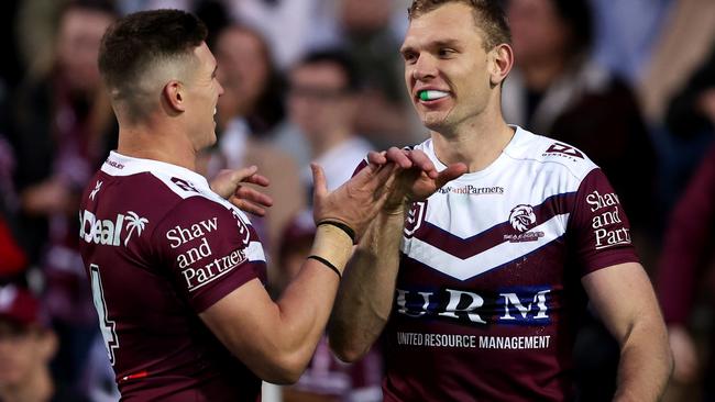 SYDNEY, AUSTRALIA - JULY 21: Tom Trbojevic of the Sea Eagles celebrates with team mate Reuben Garrick after scoring a try during the round 20 NRL match between Manly Sea Eagles and Gold Coast Titans at 4 Pines Park, on July 21, 2024, in Sydney, Australia. (Photo by Brendon Thorne/Getty Images)