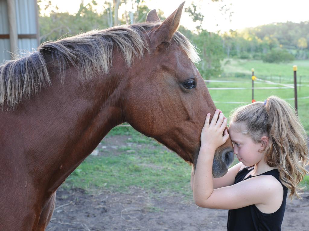 Billie Mayson-Kinder, 12, with her parents Danny and Dave and her older sister Charlie. Billie was killed in a tragic horse accident in 2016 but her legacy lives on in the B Kinder Foundation, a charity established by her loving family.