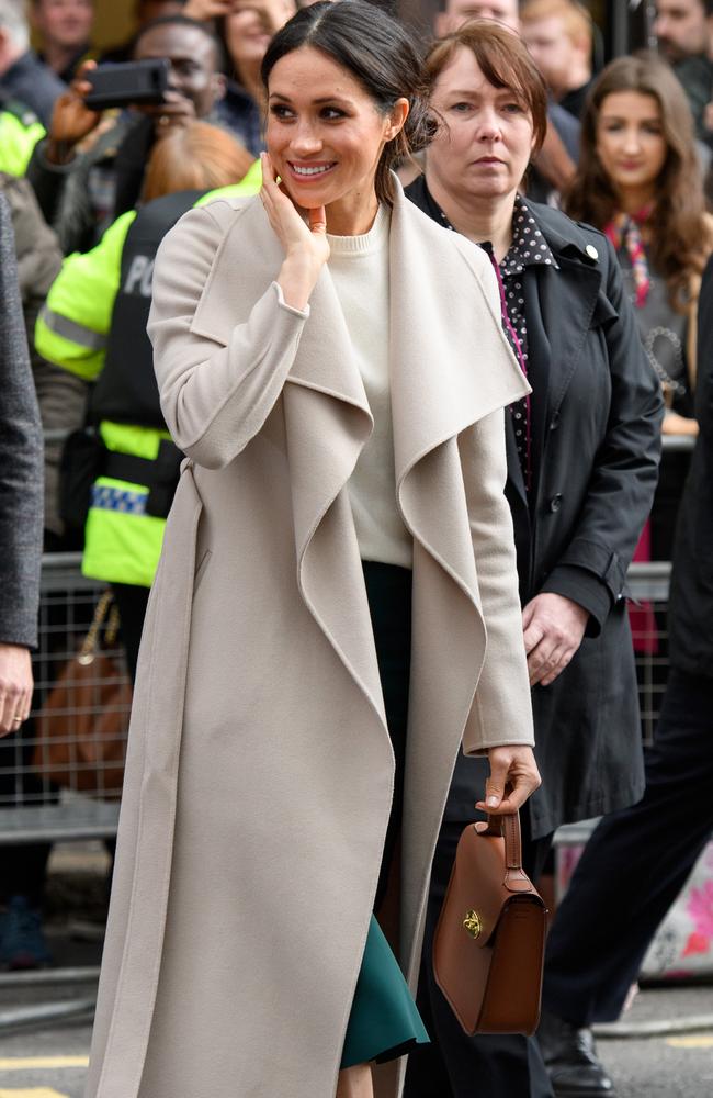 Meghan Markle wore a coat by Mackage, teamed with a Victoria Beckham knit and a pair of Jimmy Choos. Picture: MEGA TheMegaAgency.com