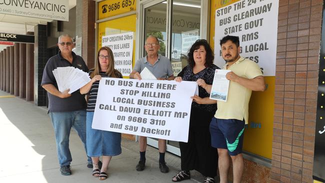 Business owners (left) Joe Laviano (Colonial Print and Copy), Loren Holmes (Speech Buzz), Anton Bognar (customer), Danielle Coronno (ITP Tax Professionals) and Mohammad Rezaee  are angry after being told a "peak hour" bus lane outside their shops on Old Northern Rd will be changed to a 24 hour bus lane, and they will lose parking for their customers. Picture: AAP Image/David Swift