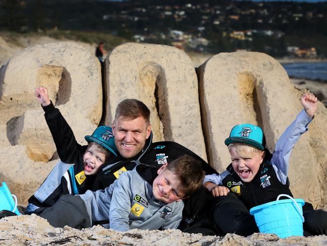 Kane Cornes with his boys Sonny, 5; Eddy, 8; and Raphael, 6 on the eve of his 300th, and last, game of AFL football. Photo: Sarah Reed.