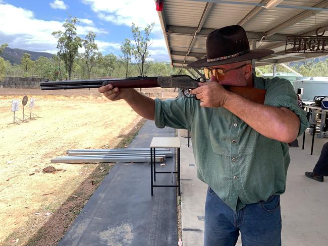 Sporting Shooters Association Australia Townsville Branch President Michael Norris practices his rifle shooting at the range.