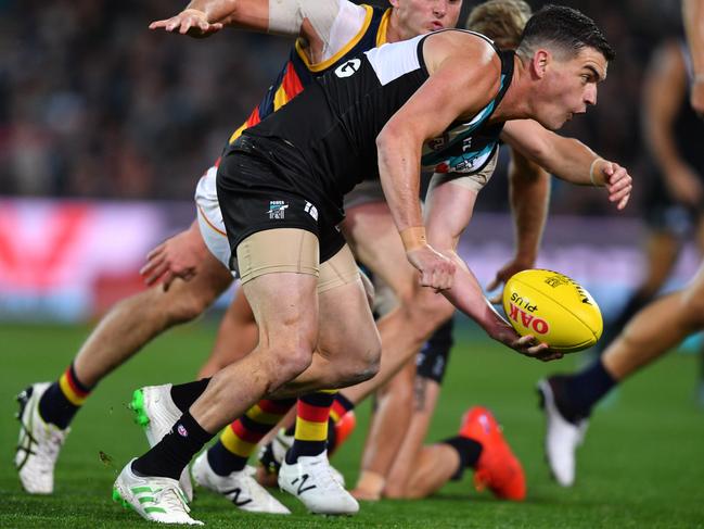 Port Adelaide midfielder Tom Rockliff gets ready to handball during his side’s 20-point Showdown 46 loss at Adelaide Oval. Picture: AAP Image/David Mariuz