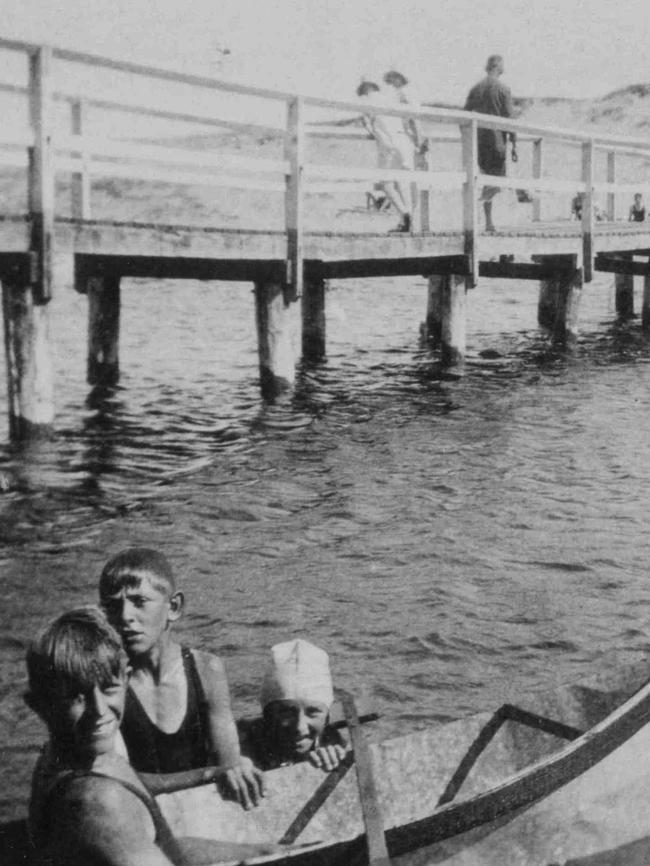 Jack, George and Brenda Trim with a small boat near the Dee Why Lagoon footbridge c1928. Courtesy Dee Why Library