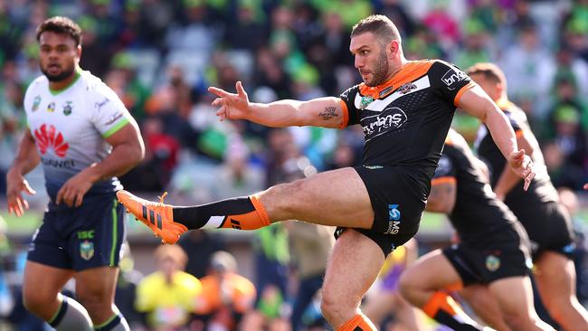 Robbie Farah kicks ahead for the Tigers against Canberra at GIO Stadium. Picture: Getty Images