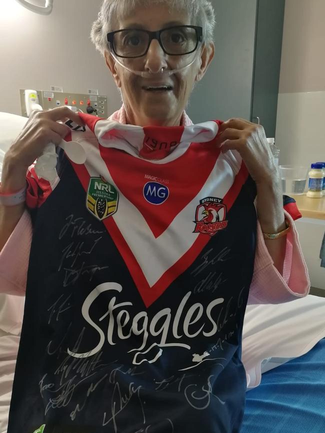 Grace Hoffmeiste and her new Roosters jersey. Picture: Channel 9