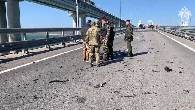 Russian investigators working on the Kerch bridge over the weekend. Picture: AFP