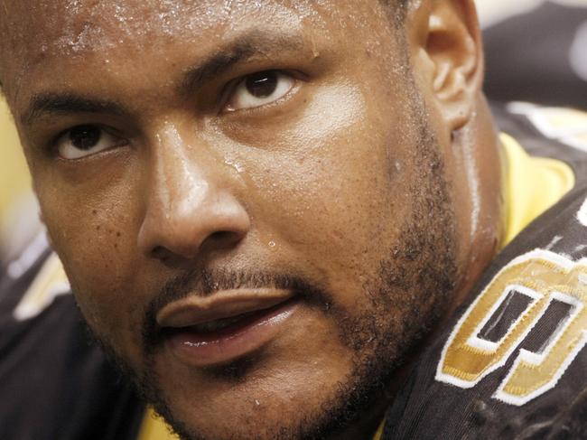FILE - In this Dec. 19, 2009, file photo, New Orleans Saints defensive end Will Smith sits on the bench during the NFL football game in New Orleans. An attorney for the family of Smith said Wednesday, April 13, 2016, that the former Saints star did not brandish a gun or have it on him before he was shot to death last weekend. (AP Photo/Dave Martin, File)