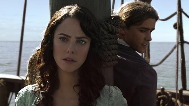 Kaya Scodelario (as Carina Smyth) and Brenton Thwaites (Young Henry) tied to the mast of The Dying Gull at The Spit in Pirates of the Caribbean: Dead Men Tell No Tales. Photo: Disney Enterprises