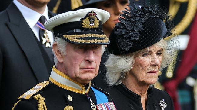 King Charles III and Britain's Camilla, Queen Consort look at members of the Bearer Party transferring the coffin of Queen Elizabeth II after the State Funeral Service. Picture: AFP