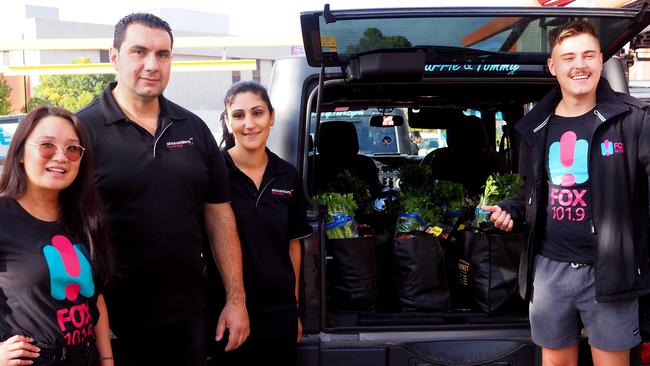 Aliyah Baynosa from Fox FM’s Black Thunder, Alex and Nicole Alexopoulos from of Alexander Produce and Xander Speight from Fox delivering fresh food to the vulnerable.