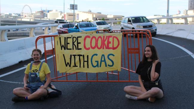 Extinction Rebellion protesters Justice and Jupiter block off a Riverside Expressway exit on Wednesday morning.