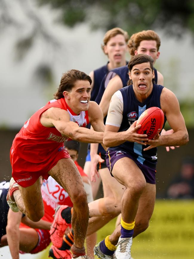 Nathan Philactides looks for an option. Picture: Morgan Hancock/AFL Photos via Getty Images