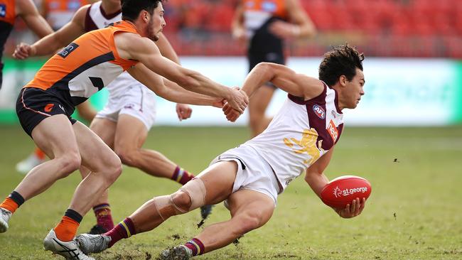 Cam Rayner of the Brisbane Lions is tackled Lachlan Ash of the GWS Giants during the round-7 AFL match on Saturday. Picture: Mark Kolbe/Getty Images