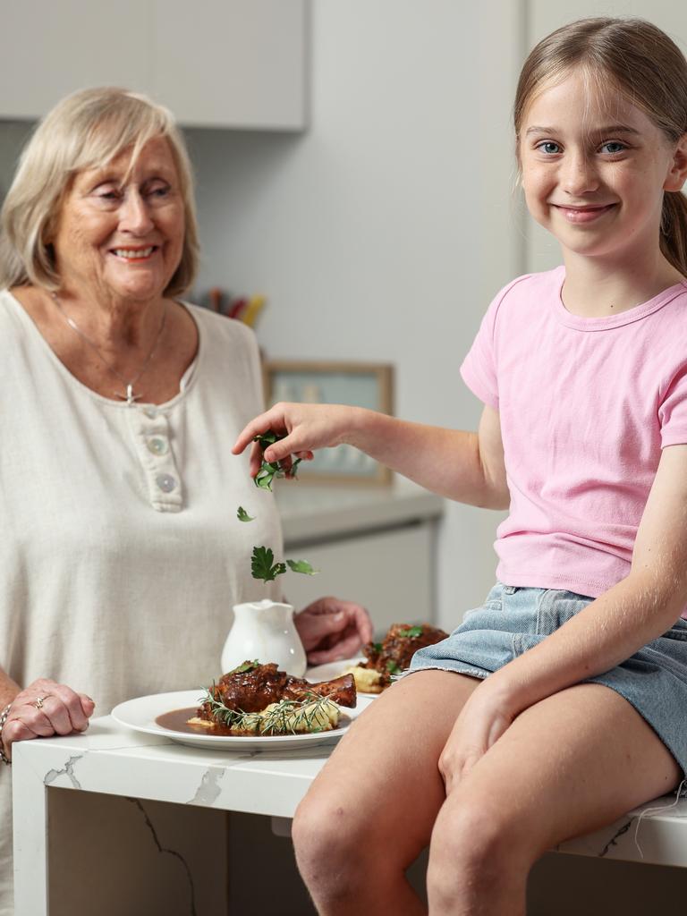 Felicity, 8, and Sheila prepping their lamb shanks dinner. Photo by Martin Keep/Coles