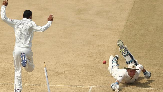 Australian batsman Peter Handscomb is run out for 82 on Wednesday.