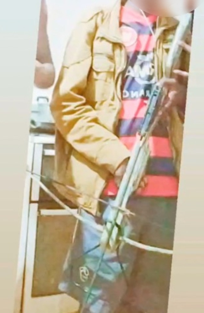 A member of Peppimenarti's notorious Jovi Boys gang poses with an illegal crossbow weapon in a social media post. Picture: Supplied