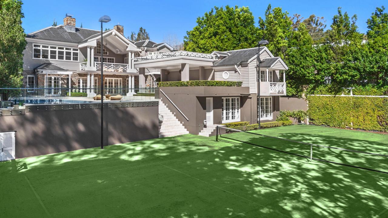 The home comes with a championship-sized tennis court.