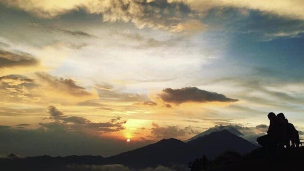 Watching sunrise from Mount Batur will make you feel like you’re in the clouds. Picture: Wotif.