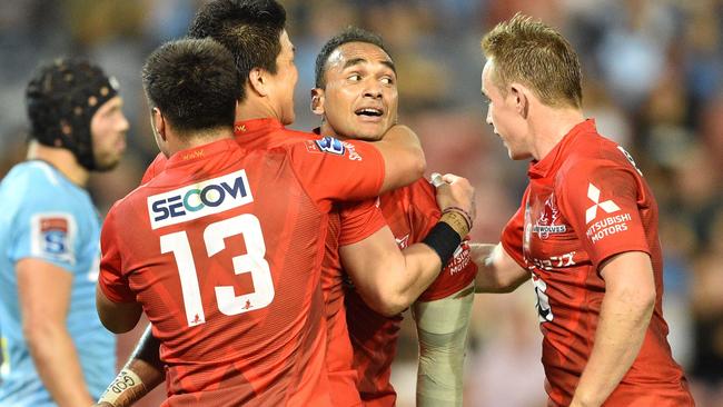 The Sunwolves' Semisi Masirewa (second right) celebrates scoring against the Waratahs on Friday night. Picture: AFP 