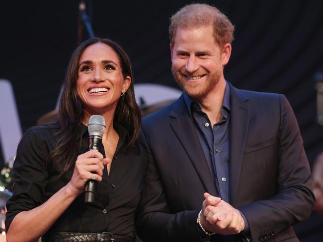 DUESSELDORF, GERMANY - SEPTEMBER 12: Prince Harry, Duke of Sussex and Meghan, Duchess of Sussex speak on stage at the "Friends @ Home Event" at the Station Airport during day three of the Invictus Games DÃÂ¼sseldorf 2023 on September 12, 2023 in Duesseldorf, Germany. (Photo by Chris Jackson/Getty Images for the Invictus Games Foundation)