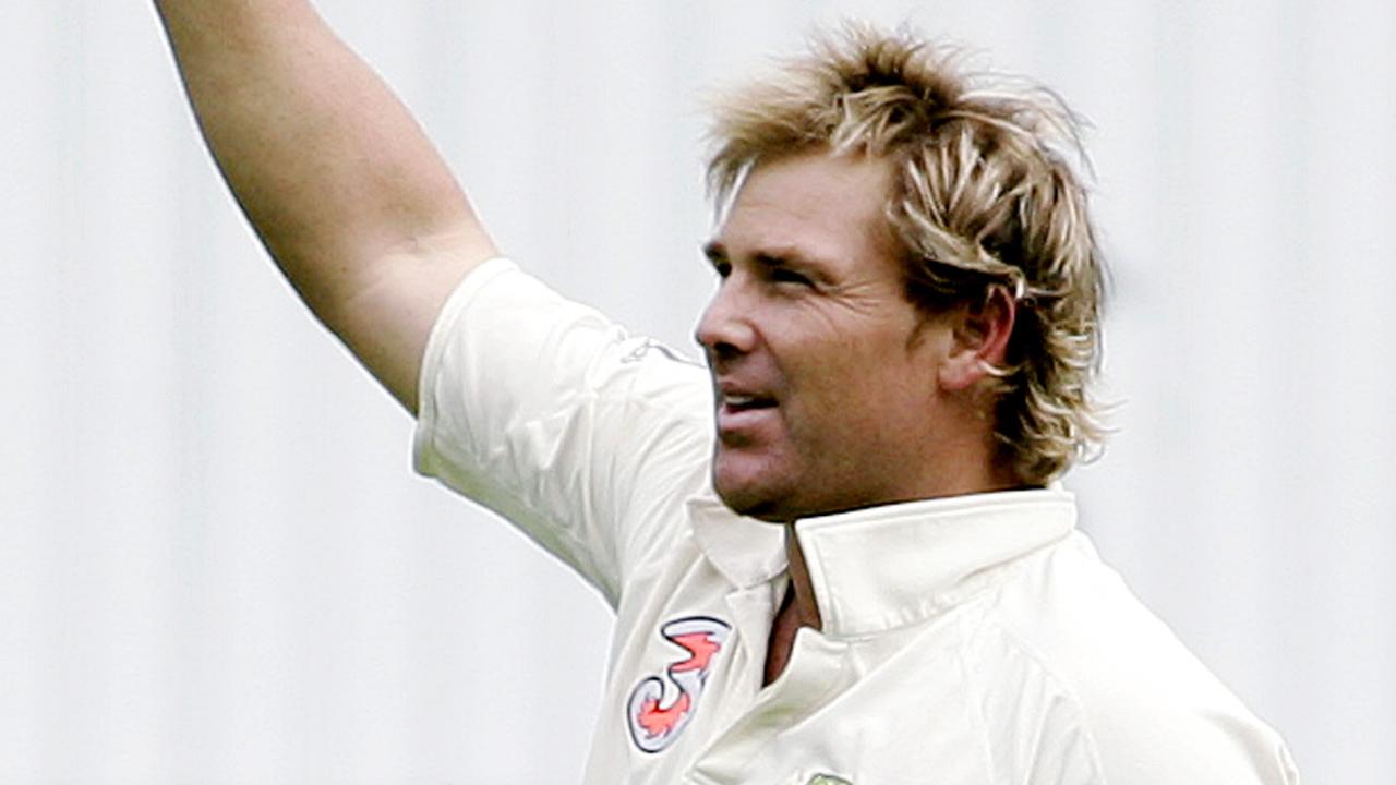 WIRE Australia's Shane Warne shows the ball as he celebrates taking the wicket of England's Andrew Strauss, bolwed for 50 runs on the first day of the Boxing Day test at the Melbourne Cricket Ground in Melbourne, Australia, Tuesday, Dec. 26, 2006. Warne now has 700 test wickets, the most by any bowler in history. (AP Photo/Rick Rycroft) **MOBILES OUT EDITORIAL USE ONLY**
