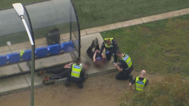 Images show the shocking moment police swooped in on the young teens at a local soccer game. Picture: Nine News